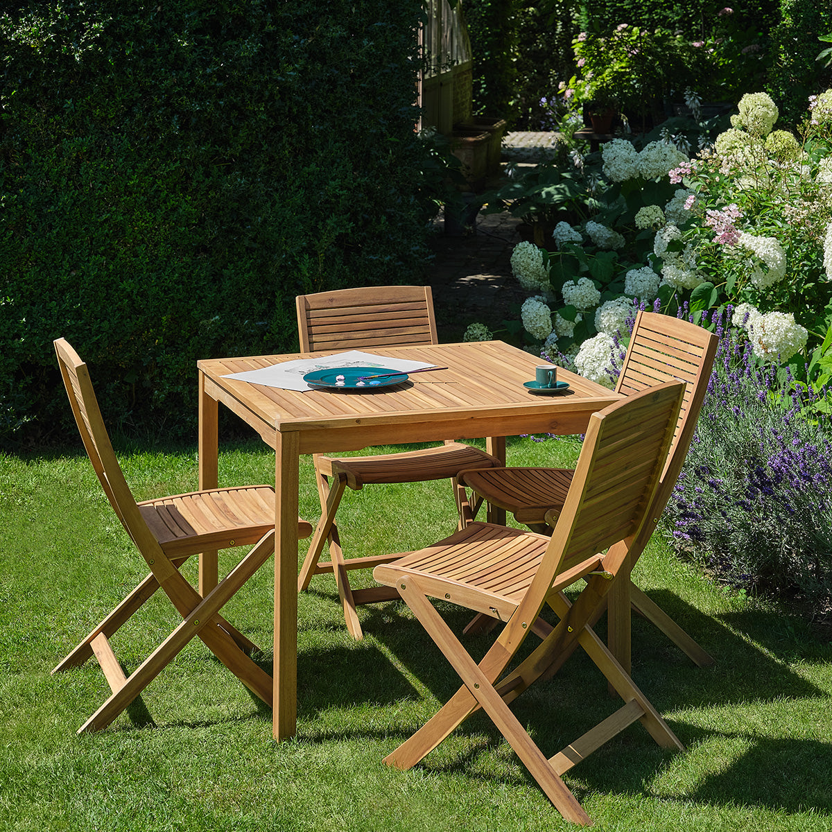 MILOS - Set da giardino in legno massello di acacia oliato, 4 posti.